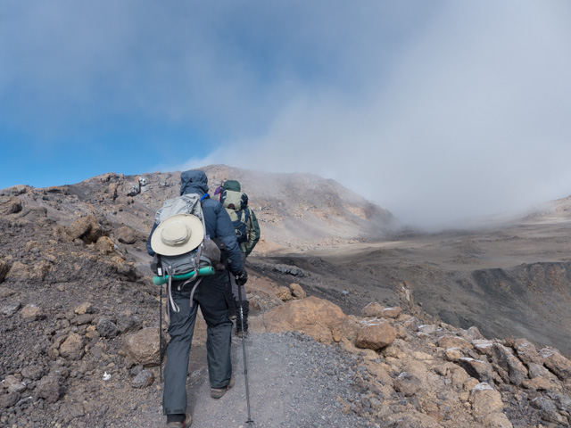 Hiking along Kibo's crater rim toward Uhuru Peak.